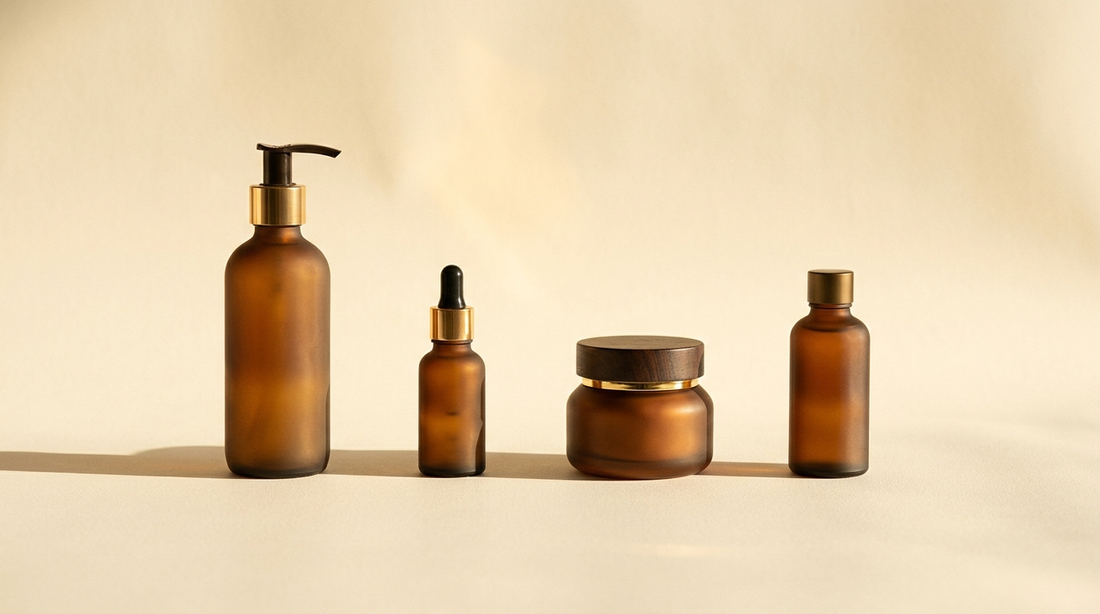 Four apothecary bottles in warm golden light on a cream backdrop, representing the SOL four-step ritual